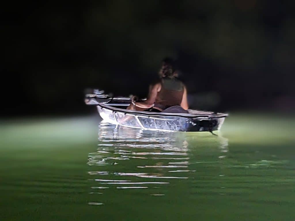 Clear bottom kayak at night
